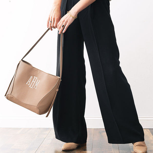 monogrammed bucket bag in taupe in arms