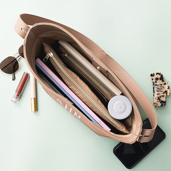 inside of taupe bucket bag