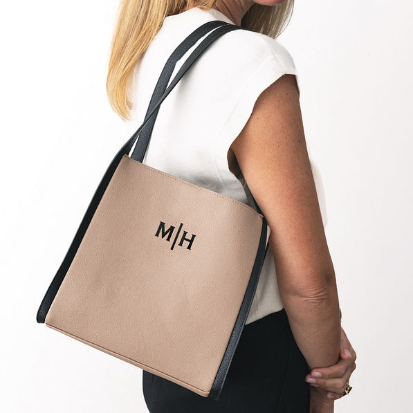 monogrammed shoulder tote in tan over shoulder