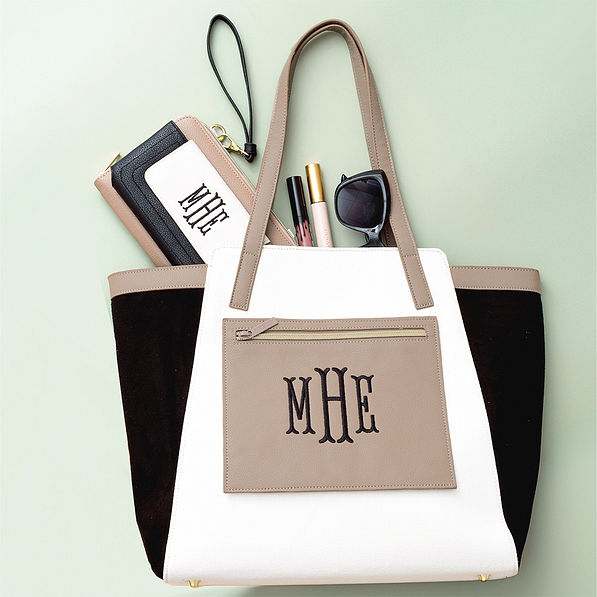black colorblock tote bag with phone wallet wristlet flatlay