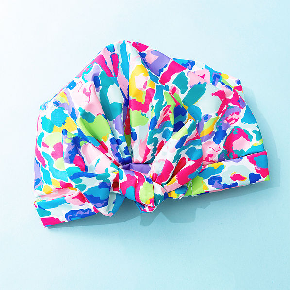 watercolor cheetah reusable shower cap on blue background