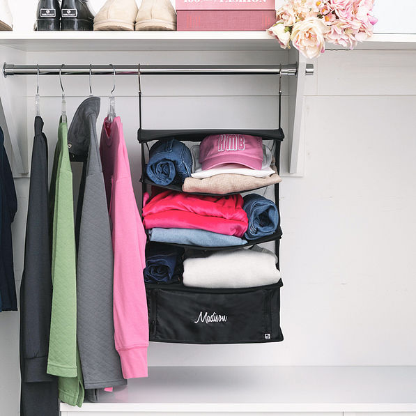 monogrammed hanging packing organizer in black on closet rack