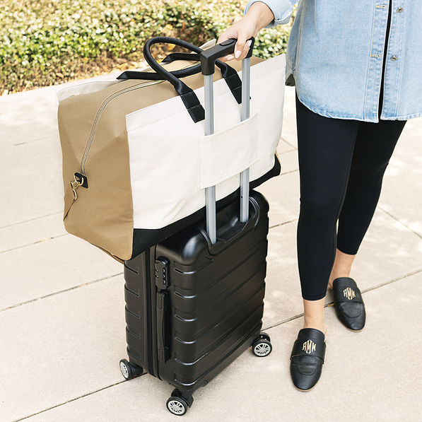 upscale monogrammed weekender in ivory on luggage