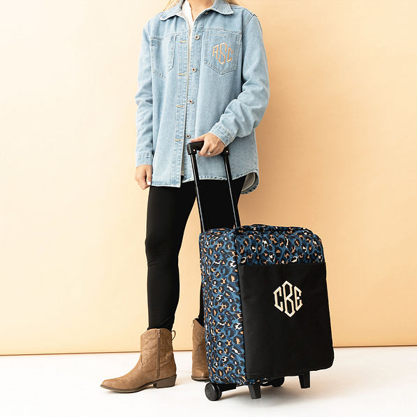 sapphire leopard rolling duffel bag in hand