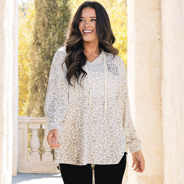 close up of girl wearing monogrammed softspun pullover in snow leopard