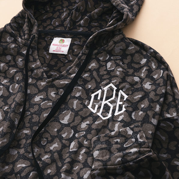 close up of monogrammed softspun pullover in onyx leopard