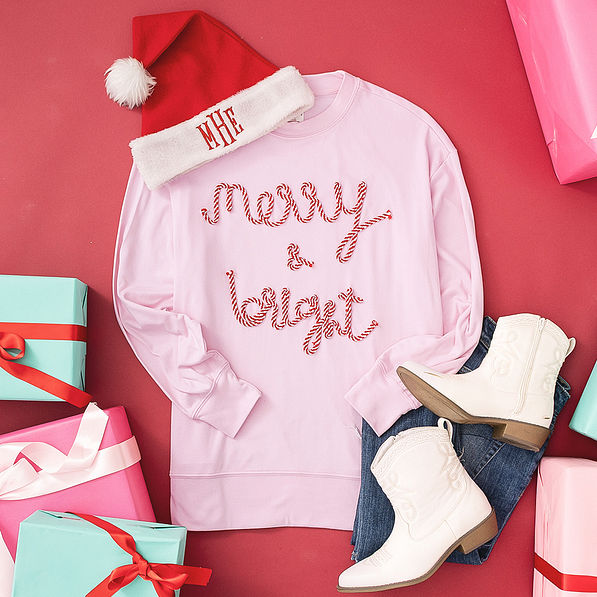 merry and bright light pink christmas sweatshirt with santa hat
