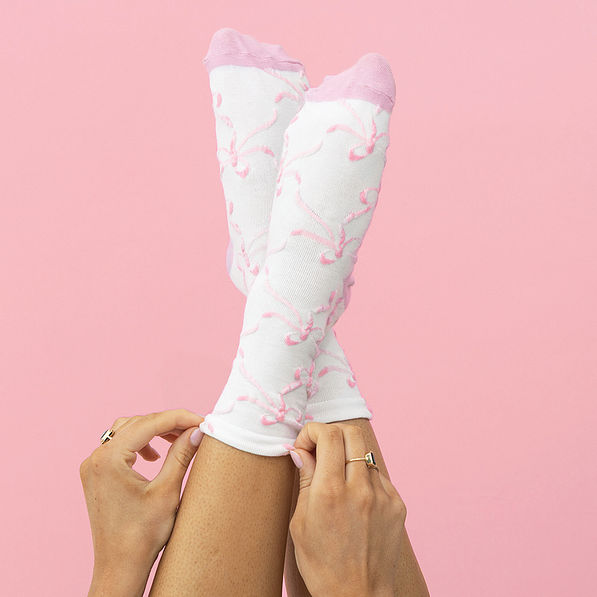 girl wearing pink bow socks
