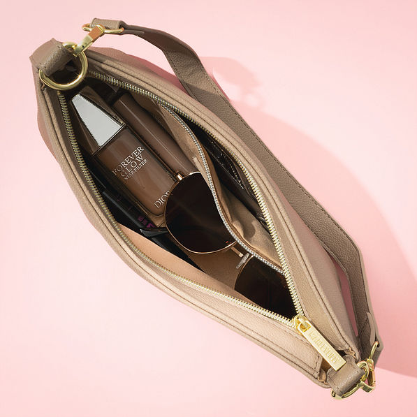 inside of tan shoulder bag