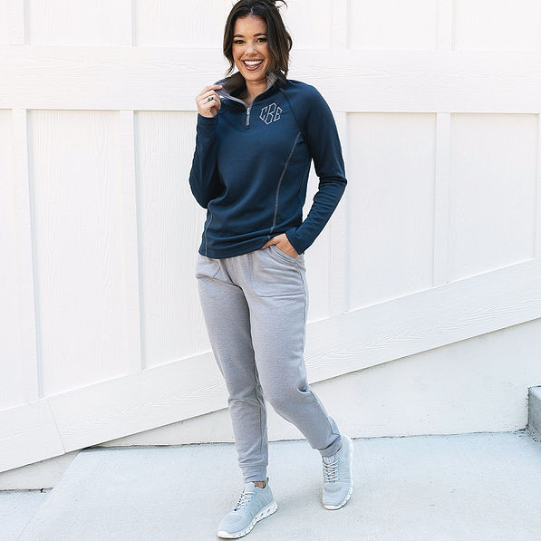 navy athletic pullover worn by girl in sweats