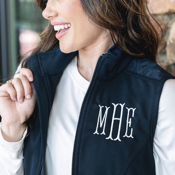 close up of navy monogrammed lightweight vest