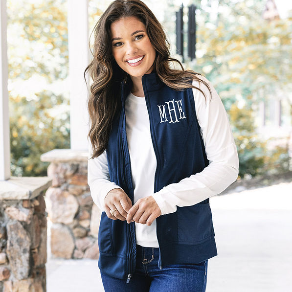 girl wearing monogrammed lightweight vest in navy