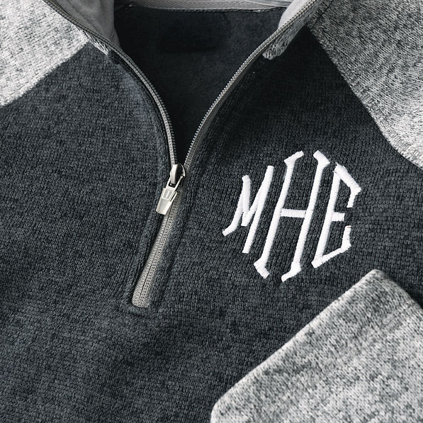 close up of monogrammed colorblock quarter zip fleece pullover in heathered charcoal