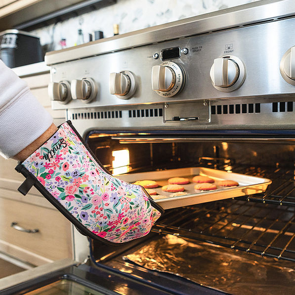 coral floral neoprene oven mitt making cookies