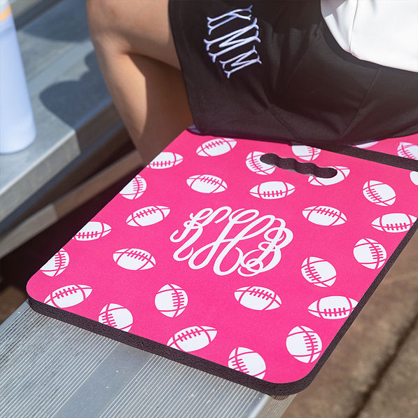 pink rubber seat cushion on bleacher