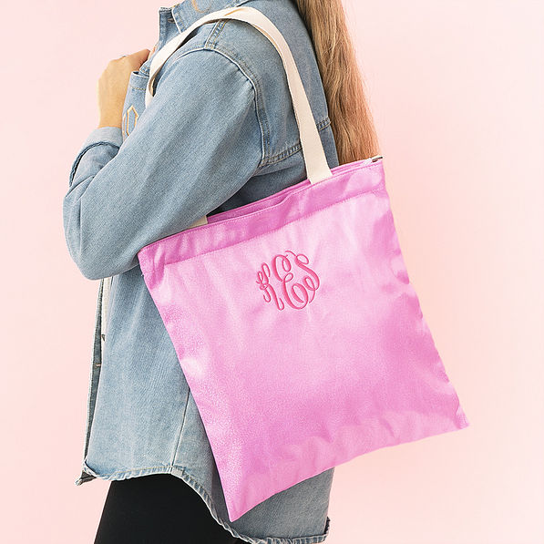 girl with personalized shimmer tote bag in pink over shoulder