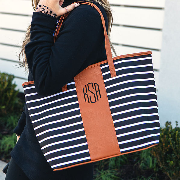 monogrammed tote bag on shoulder