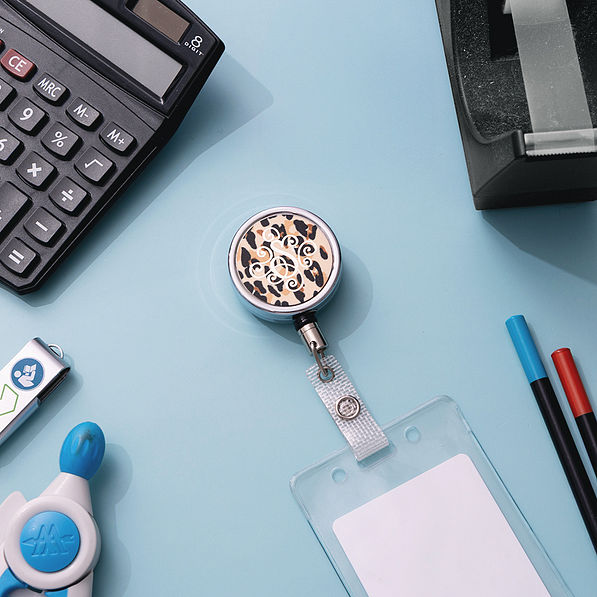 classic cheetah personalized badge reel on desk