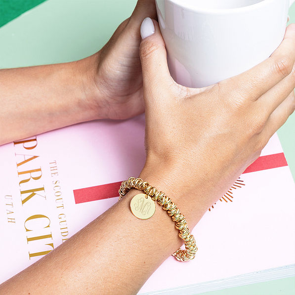 gold twisted knot bracelet with mug