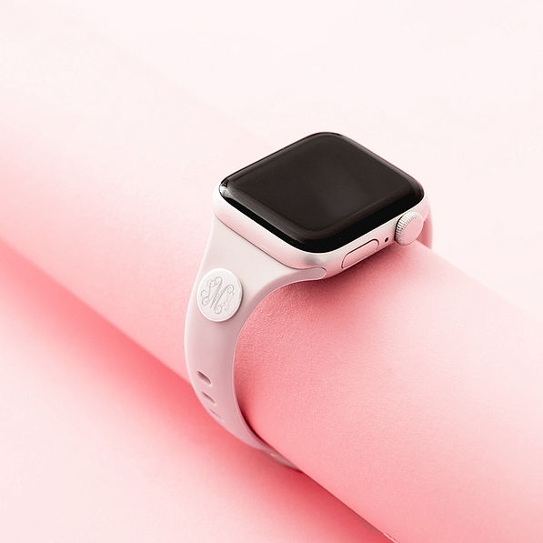 taupe watch band on pink background
