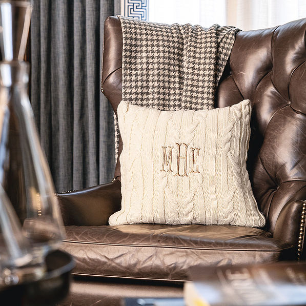 ivory cable knit pillow sham on chair