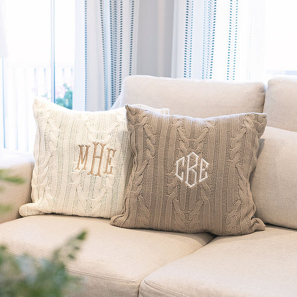 two cable knit pillow shams on couch