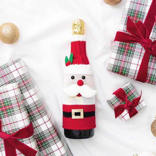 santa wine bottle sweater flatlay