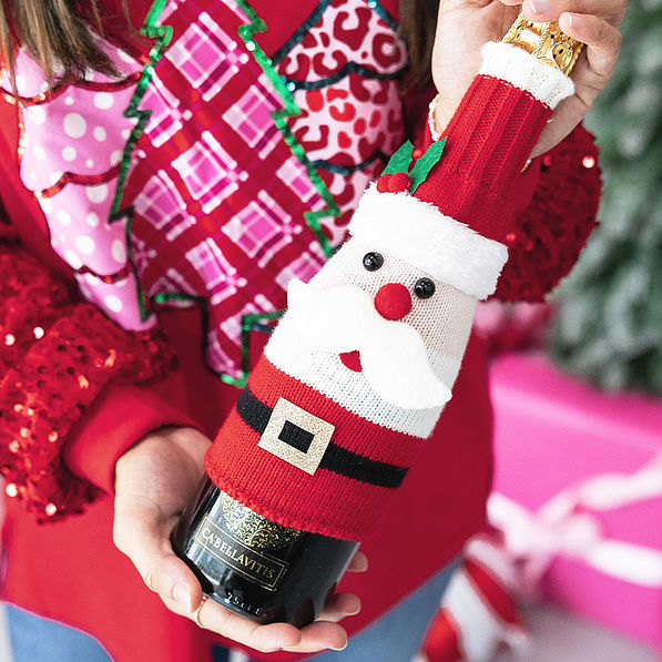 santa wine bottle sweater in hands