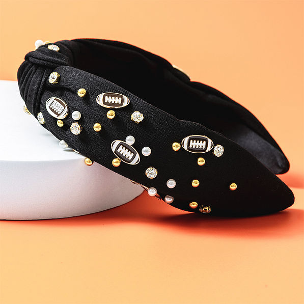 black football headband on orange background