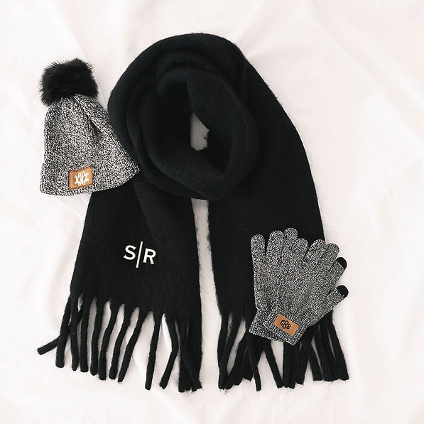 black oversized scarf with gloves and hat flatlay