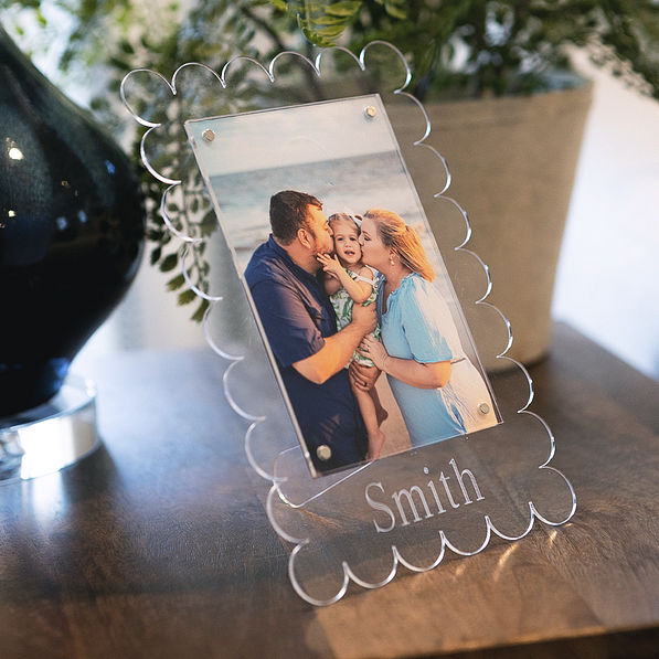 family photo in scalloped picture frame with plants