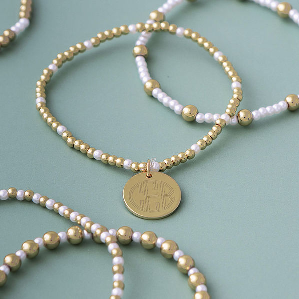 pearl gameday bracelet stack on sage background