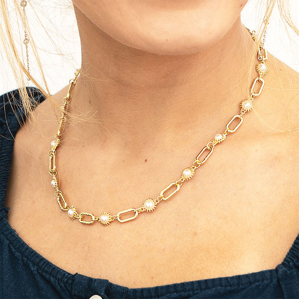 gold pearl starburst necklace on bella