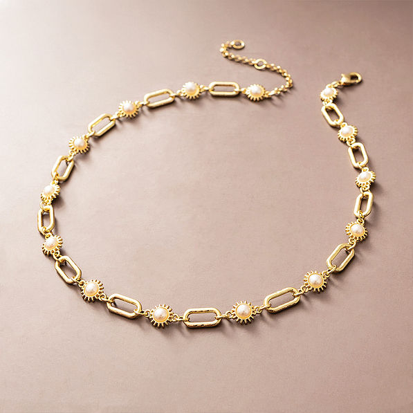 gold pearl starburst necklace studio shot