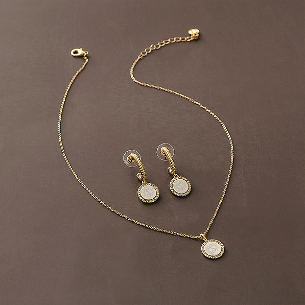 pave cable necklace and earrings on brown