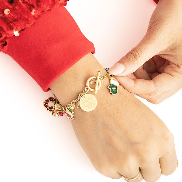 girl wearing monogrammed christmas charm bracelet