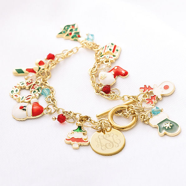 close up of monogrammed christmas charm bracelet