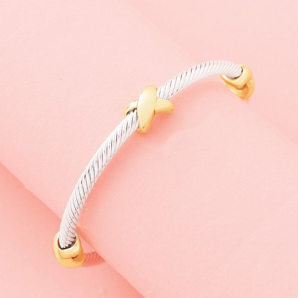 cable bangle in multi silver on pink background