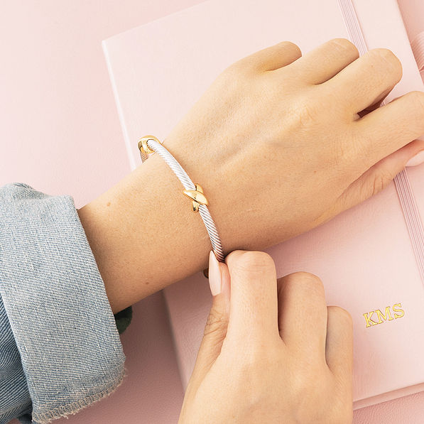 cable silver and gold bangle on wrist
