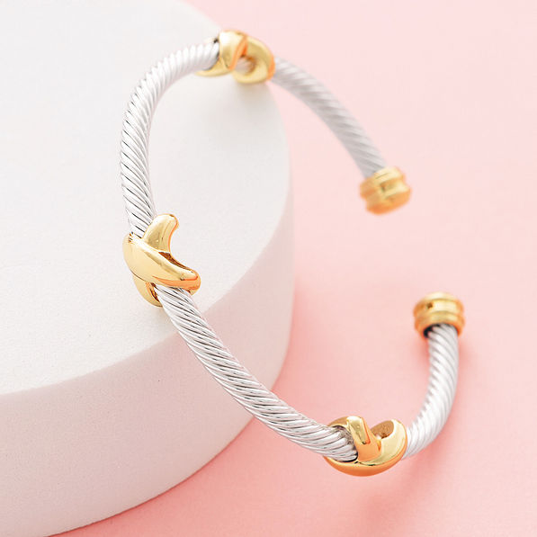 close up of silver and gold cable bangle