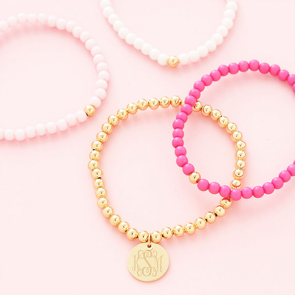 pink beaded bracelet set flatlay