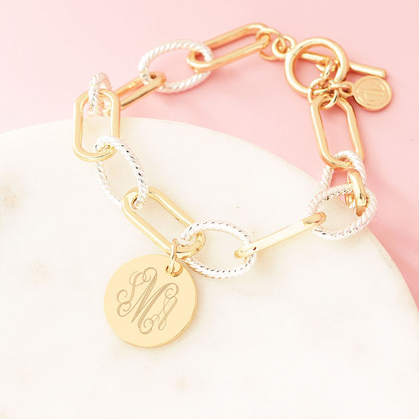 mixed metal chainlink bracelet on marble dish