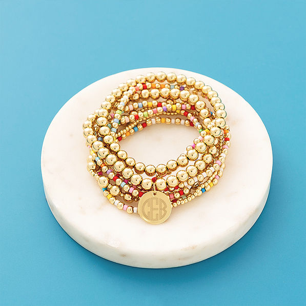 Colorful bracelet stack on blue