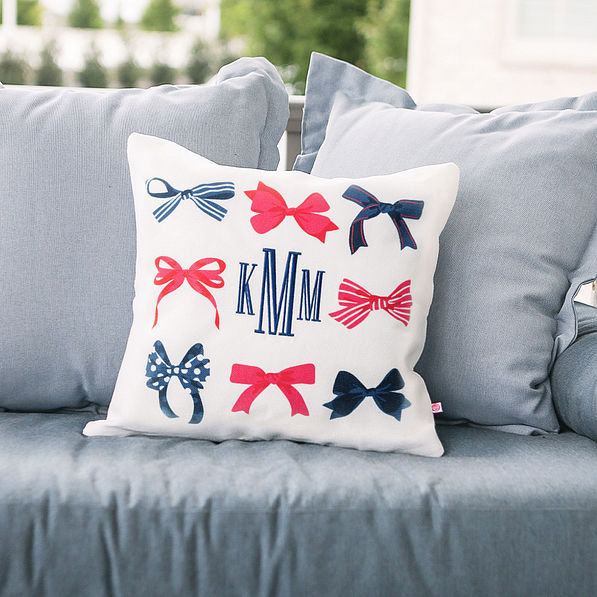 monogrammed bows fourth of july pillow on couch