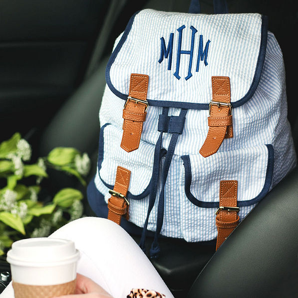 monogrammed blue seersucker backpack in the car