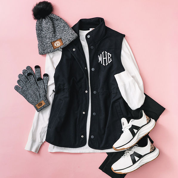 black monogrammed sweatshirt vest outfit