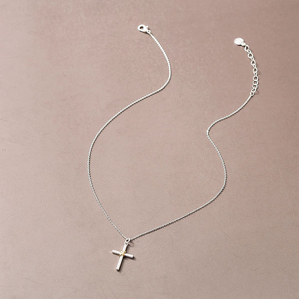 cable cross necklace on brown