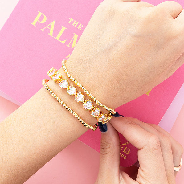 gold rhinestone heart bracelet on arm