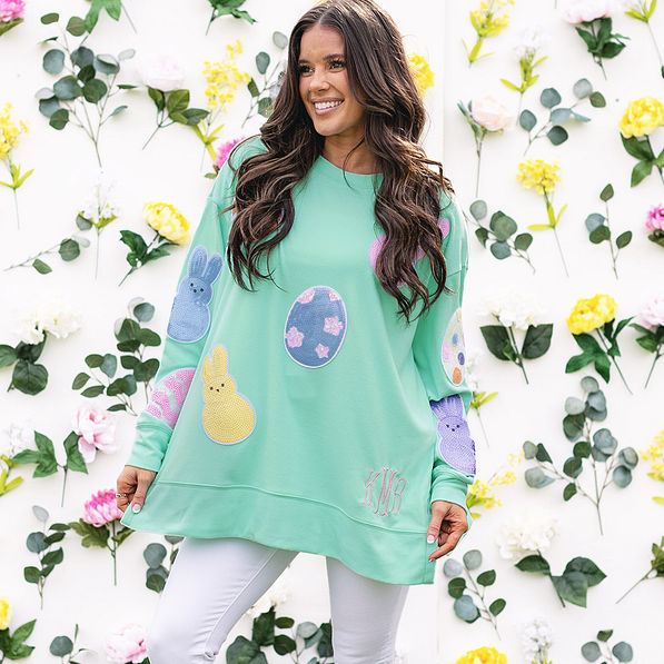 girl wearing personalized easter sweatshirt with floral background