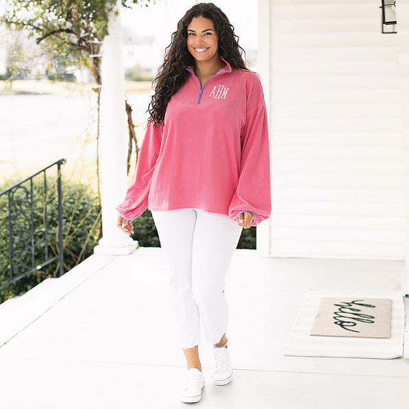 girl wearing monogrammed puff sleeve fleece pullover in pink